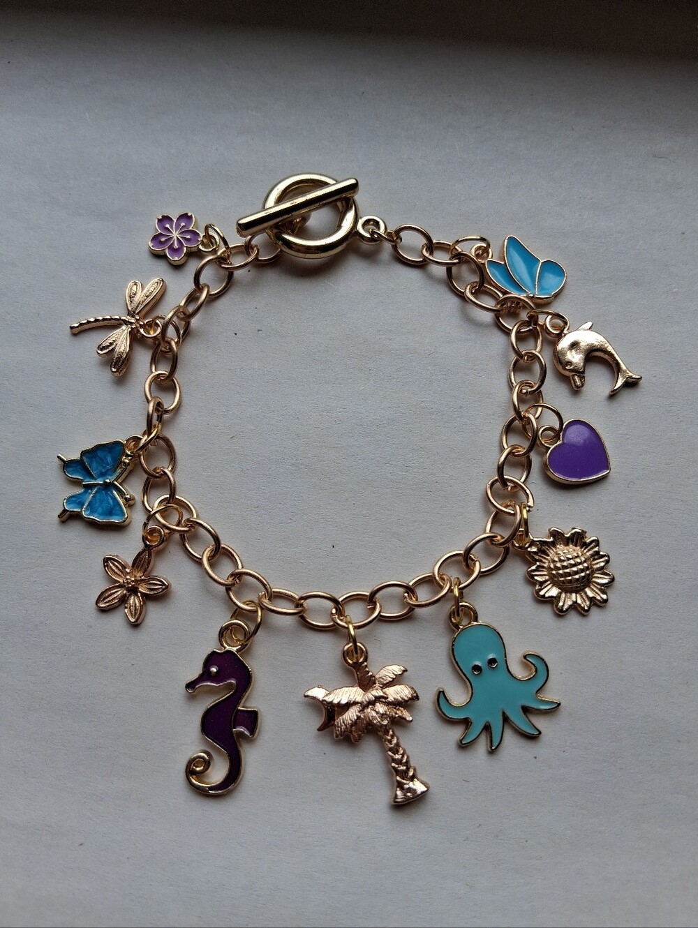 Hand Crafted Gold-tone Enamel Charm Bracelet with Blue & Purple Accents